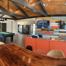 lounge room on wood-style flooring with ample seating